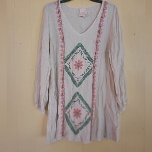 Sincerely Mary, Large cream colored dress with embroidered flowers and leaves.